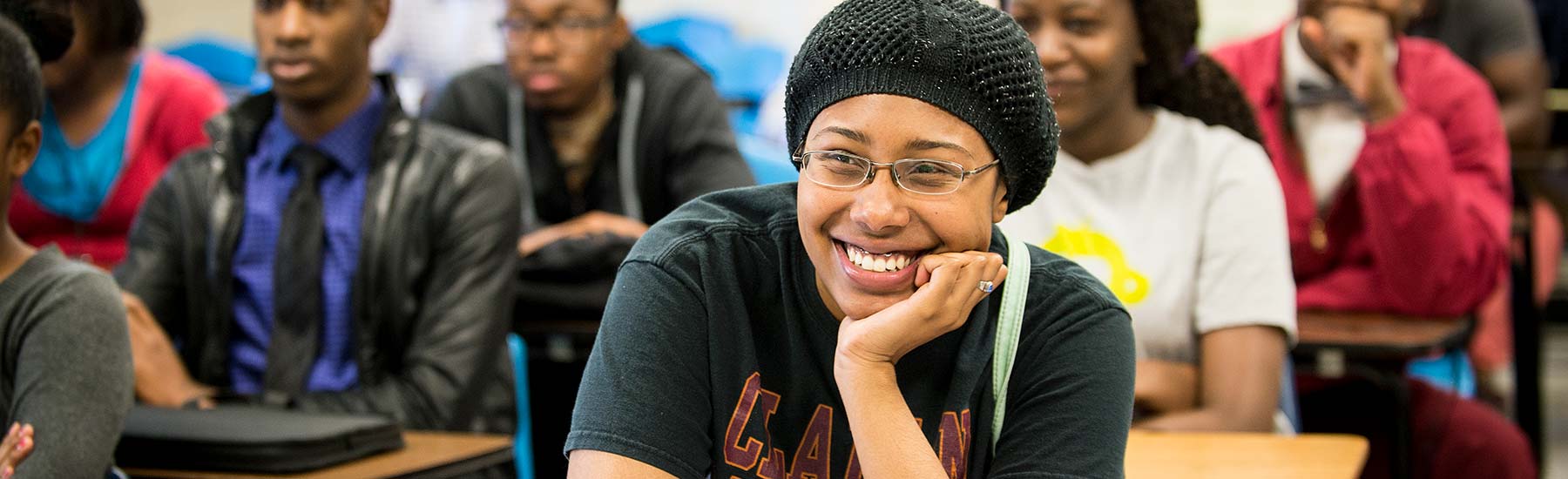 Claflin student smiling in a classroom