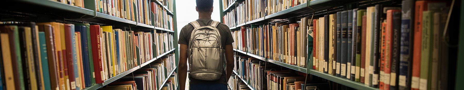 Claflin student walking through the library