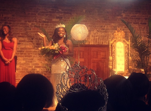 Laqueena Williams waving to crowd with bouquet