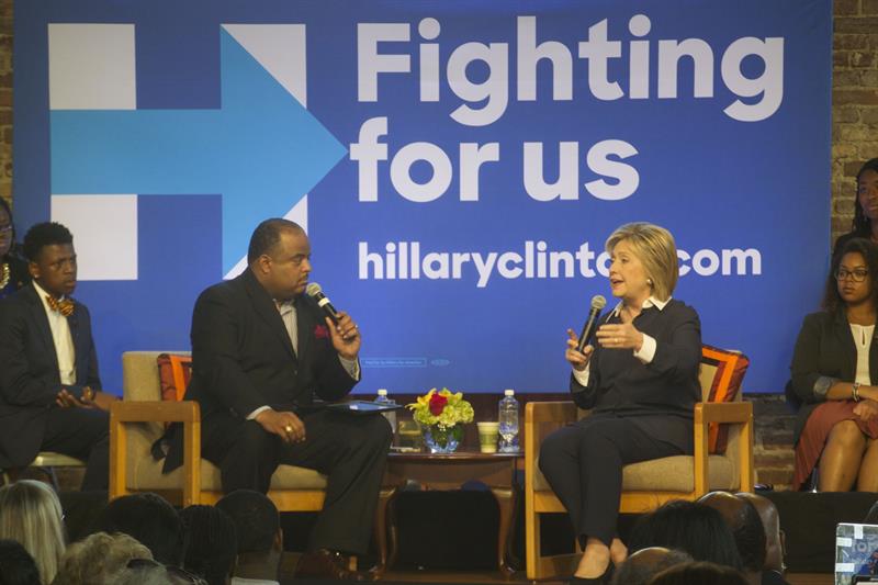 Clinton and Panel Discussing Student Loans