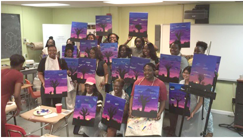 panther-calabash-paint-it-out-tammy-white CALA-Bash workshop participants holding their artwork