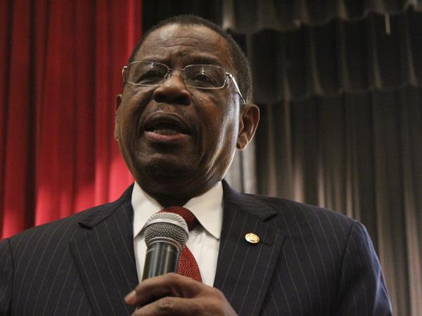 tisdale-speaking President Tisdale Holding Microphone