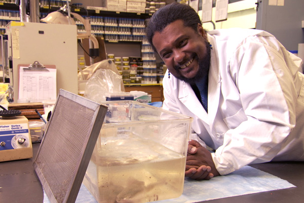 Dr Hayes smiling in his lab