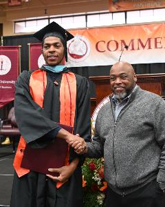 Claflin baskeball standout Jamaal Charles and men&#39;s head coach Ricky Jackson