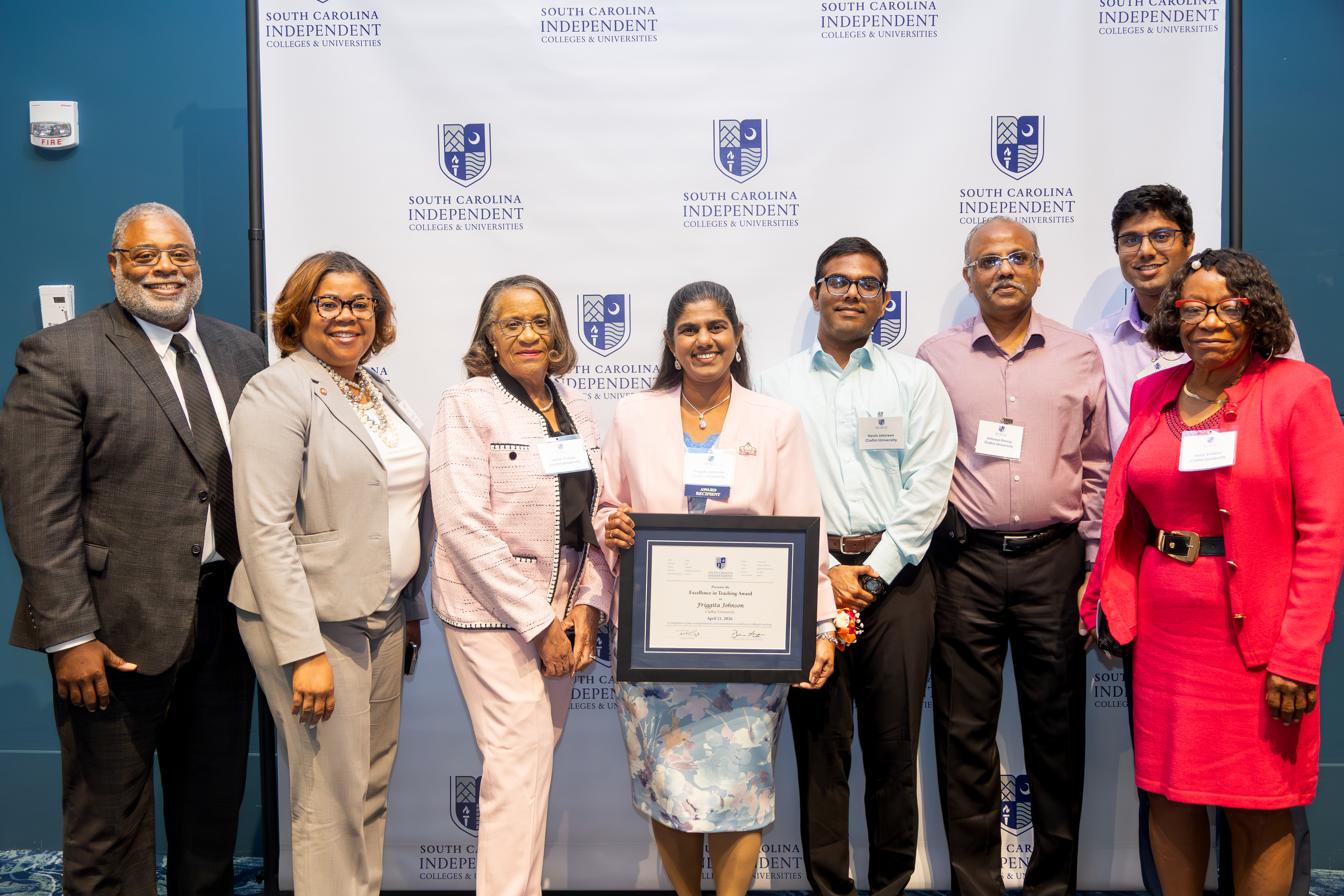 Dr. Friggita Johnson receiving SCICU Excellence in Teaching Award
